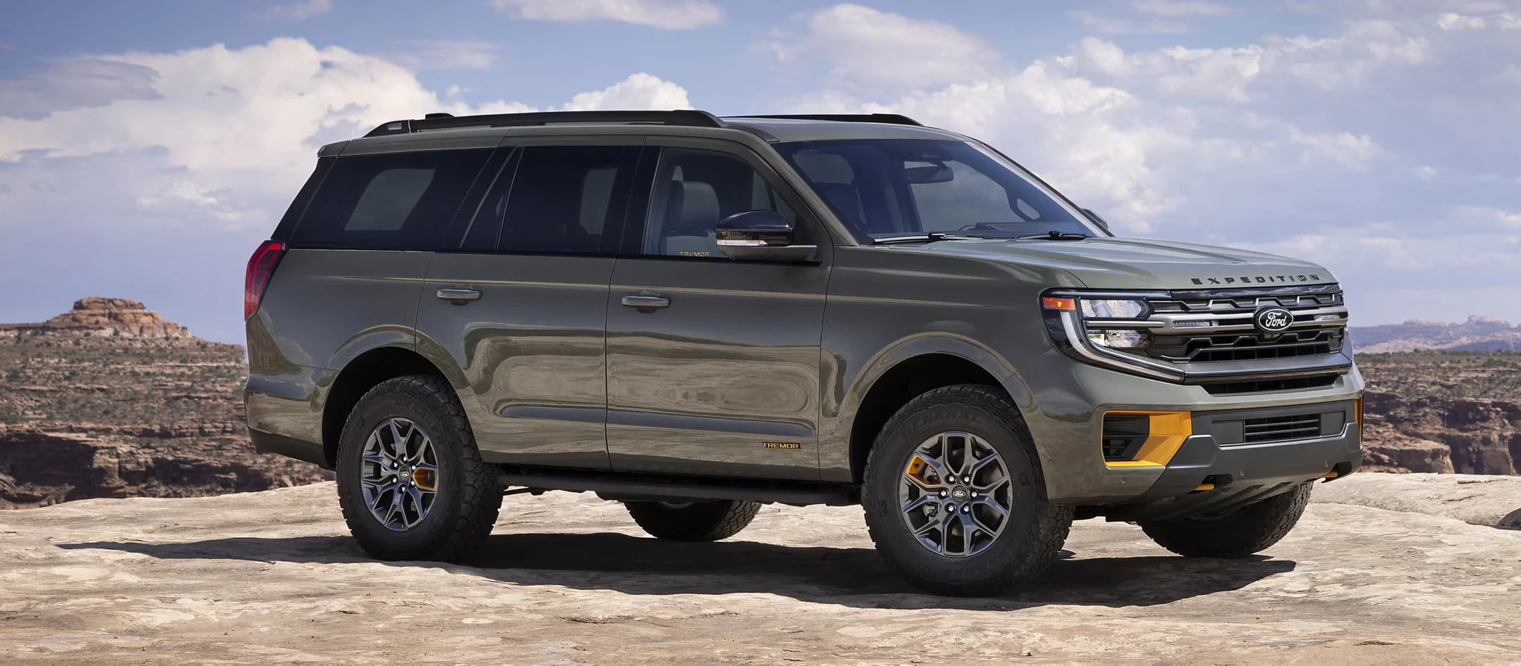 2025 Ford Expedition parked in desert landscape with rocky terrain
