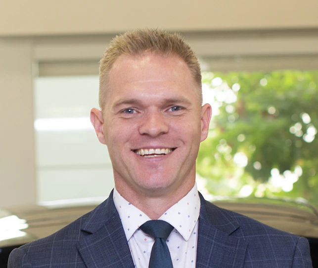 Go Auto Merlin Ford sales team member Dan in business attire