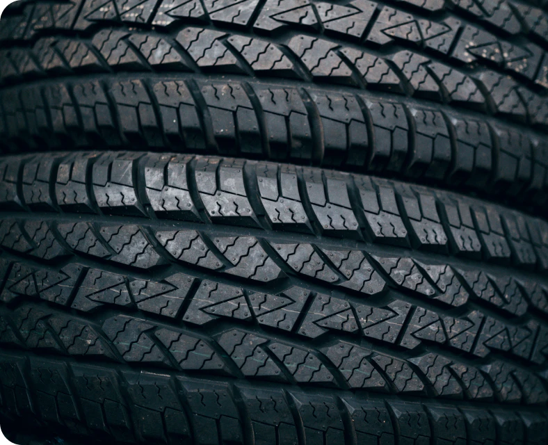 A close-up of two tires, stacked on top of each other