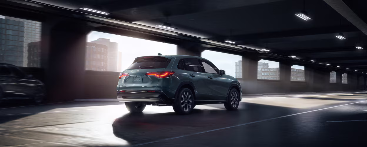 2026 Honda HR-V driving through a covered bridge.