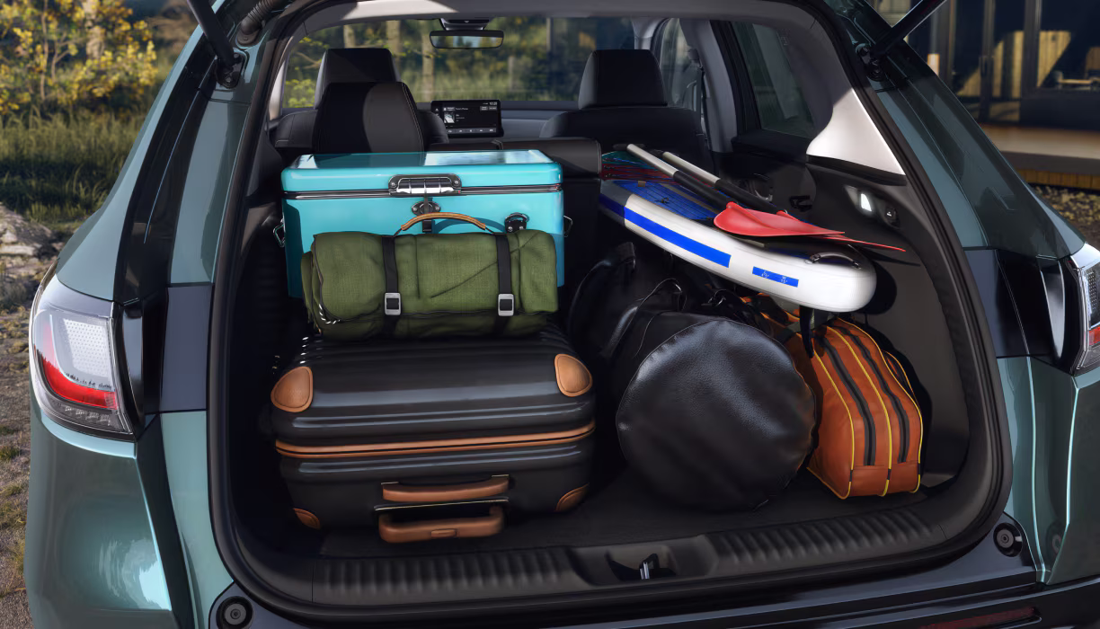 2026 Honda HR-V open trunk with luggage and gear inside. Up to 1,559 litres of cargo space with 60/40 split fold-down rear seats.