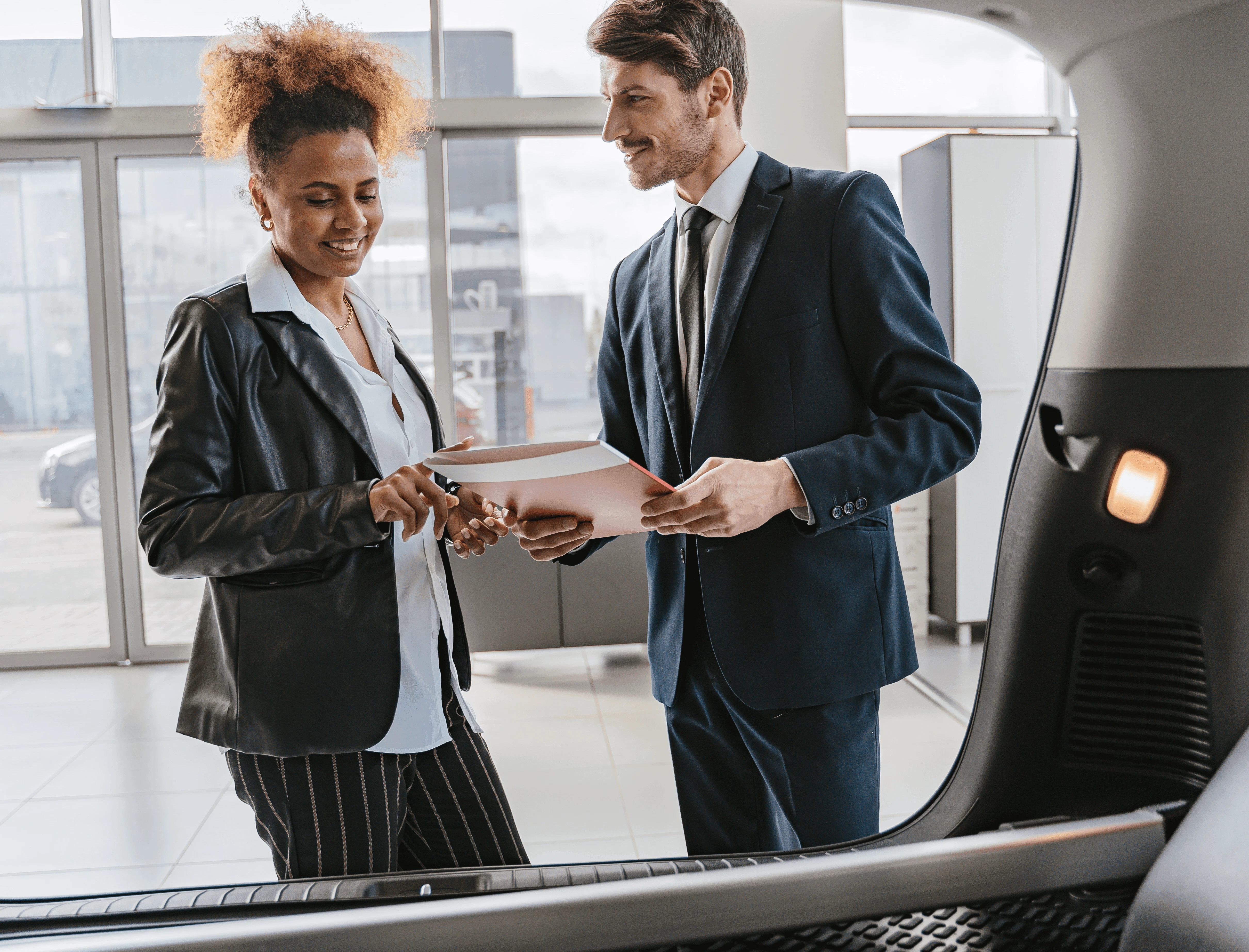 A man and woman in business attire talking