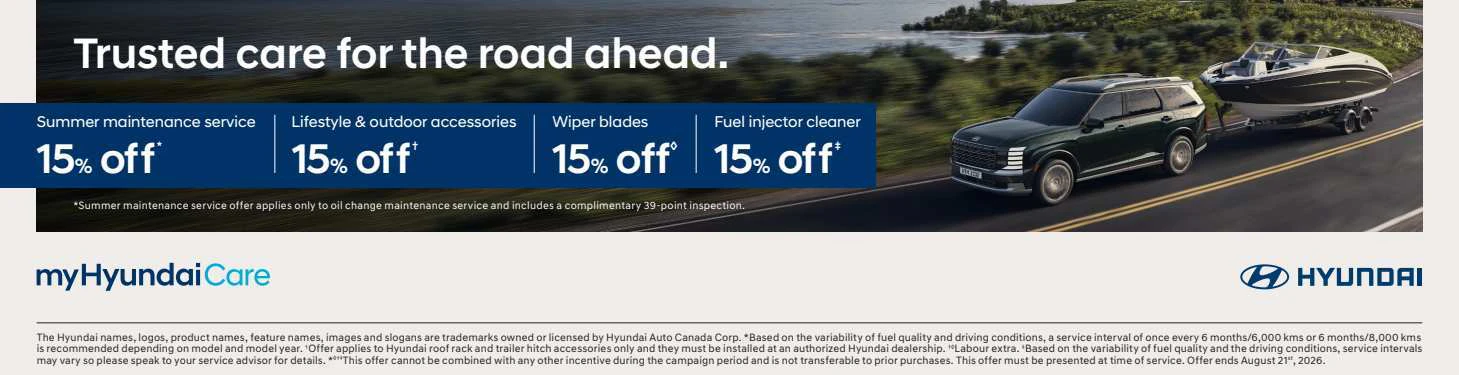 Hyundai vehicle towing a boat on highway with summer maintenance service discounts displayed
