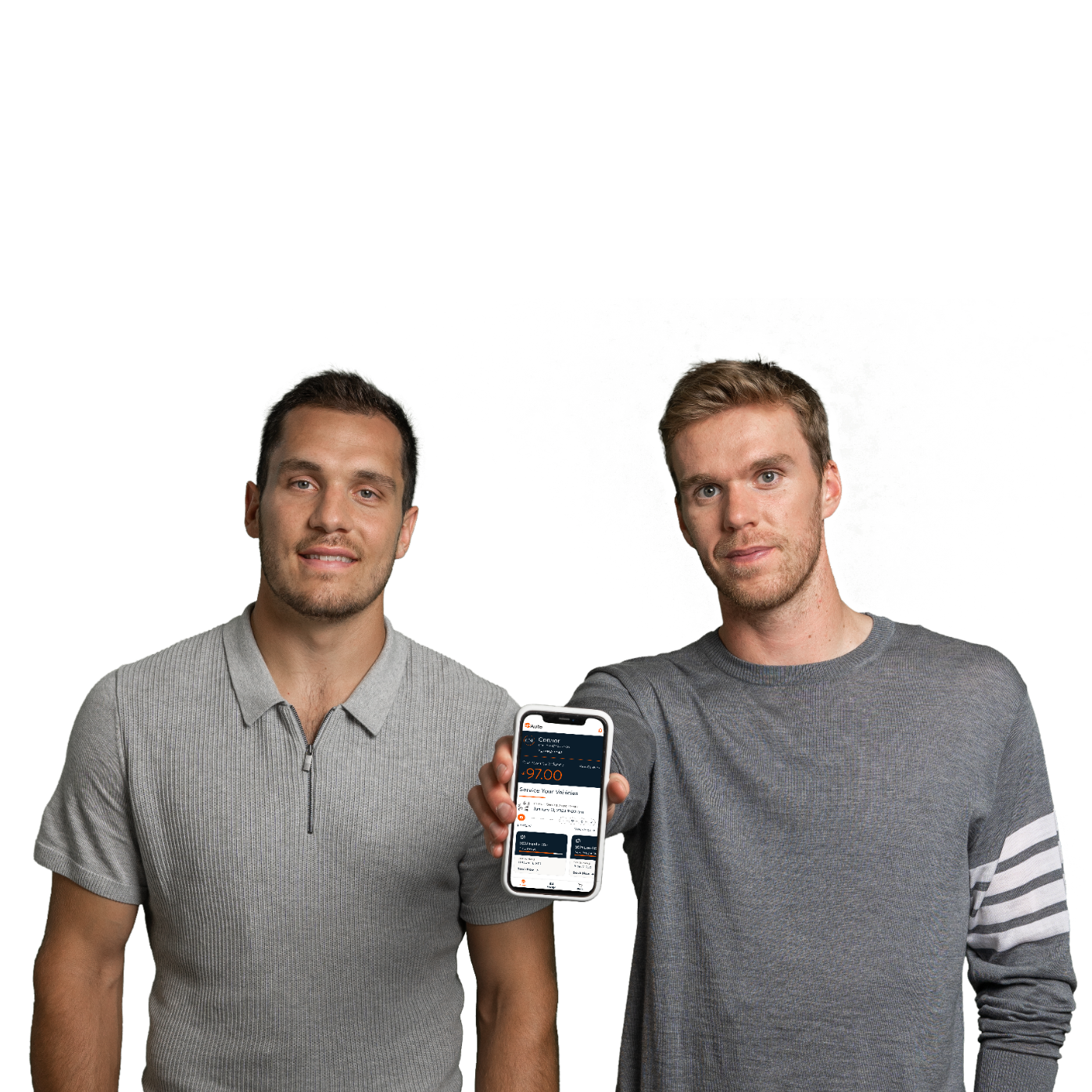Connor McDavid and Bo Horvat are smiling and holding an iPhone, with the Go Auto app displaying on the screen