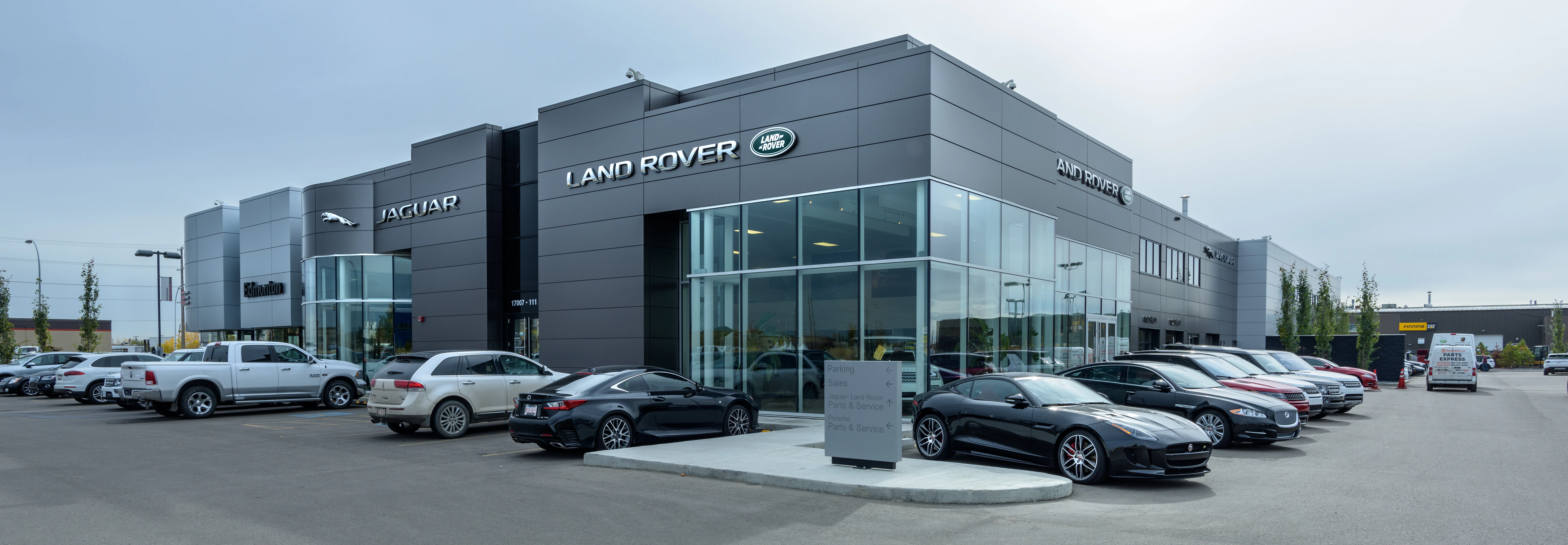 Go Auto Jaguar Land Rover dealership exterior with vehicles displayed in lot