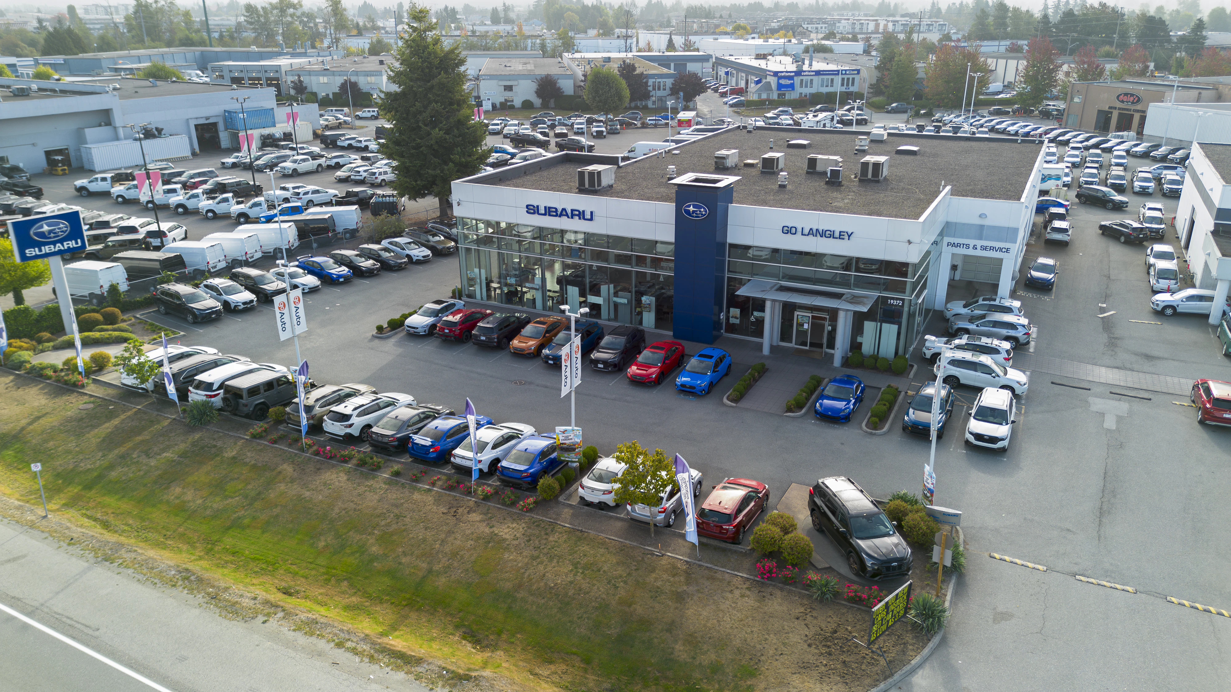 Go Langley Subaru dealership exterior with showroom building and inventory lot