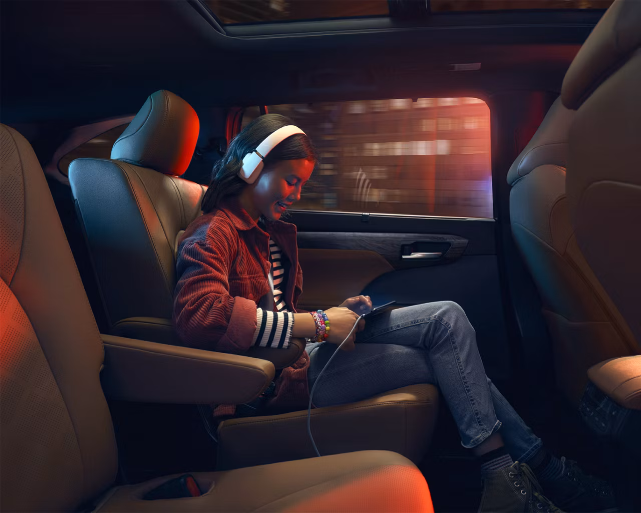 Toyota 2026 Highlander Hybrid interior child playing games