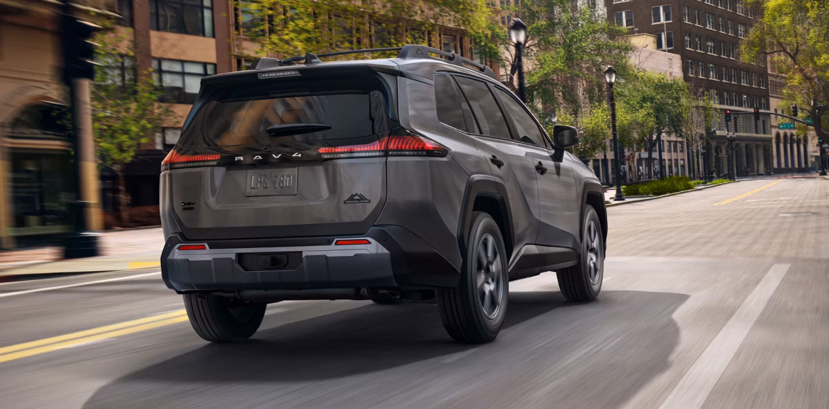 Toyota 2026 RAV4 driving in the city.