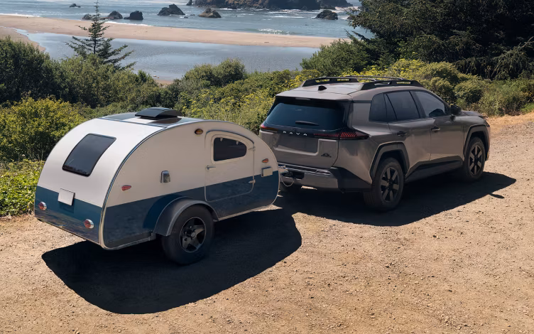 Toyota 2026 RAV4 towing outdoors.