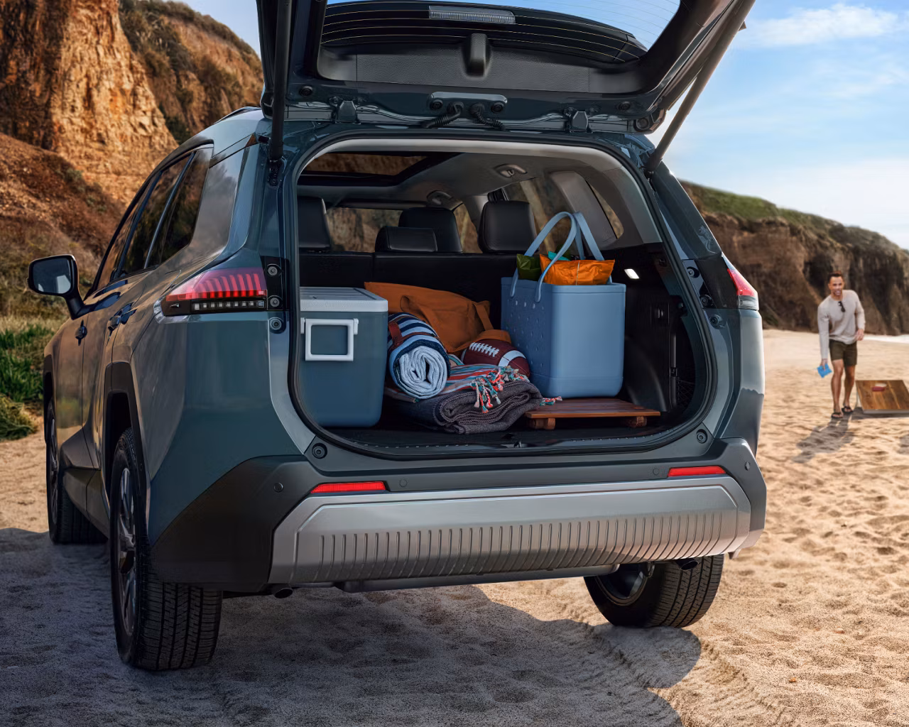 Toyota 2026 RAV4 cargo space with trunk open.
