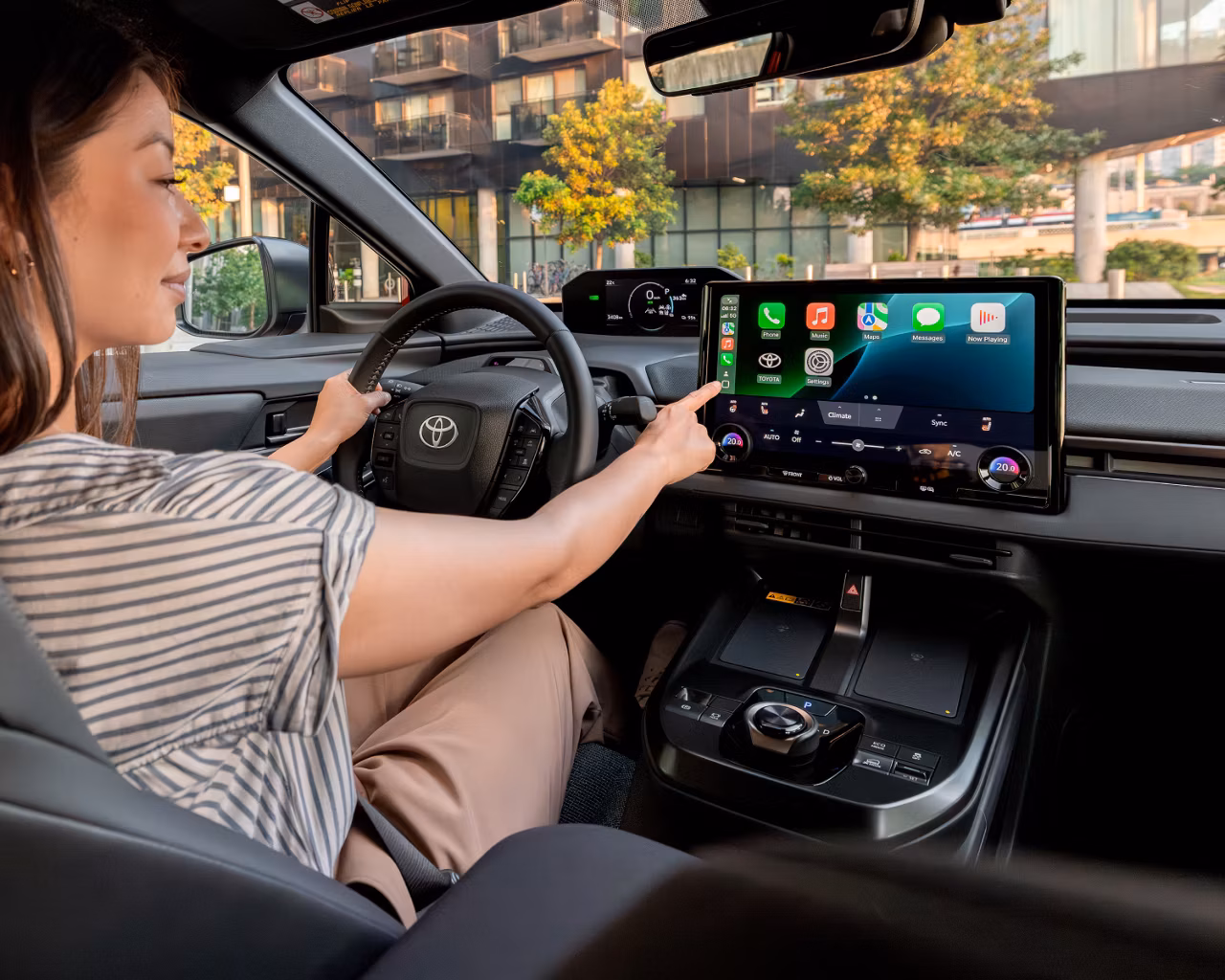 Toyota on the Trail 2026 bZ Limited interior with woman and Apple Carplay