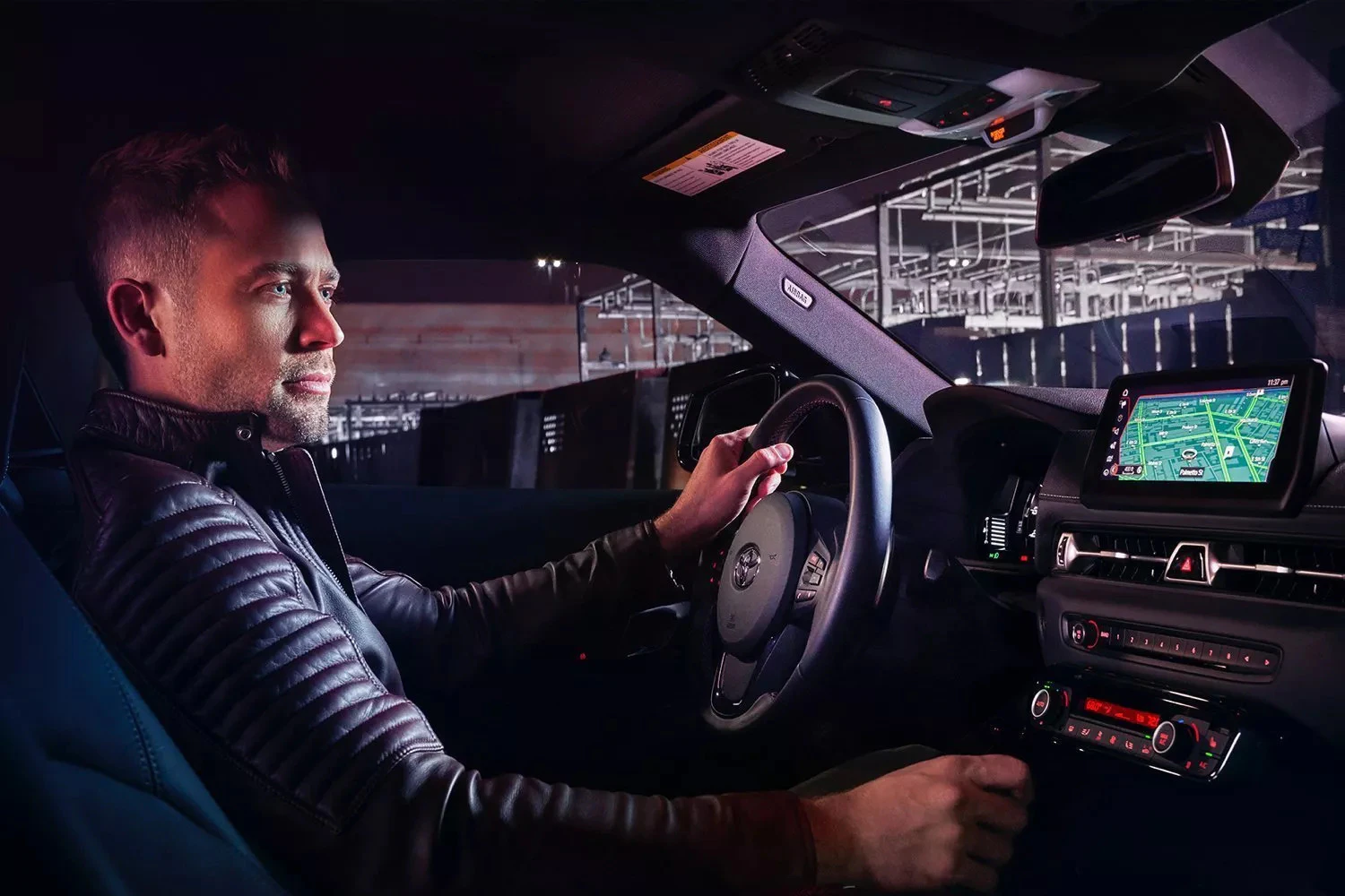 Man inside Toyota driving the car at night