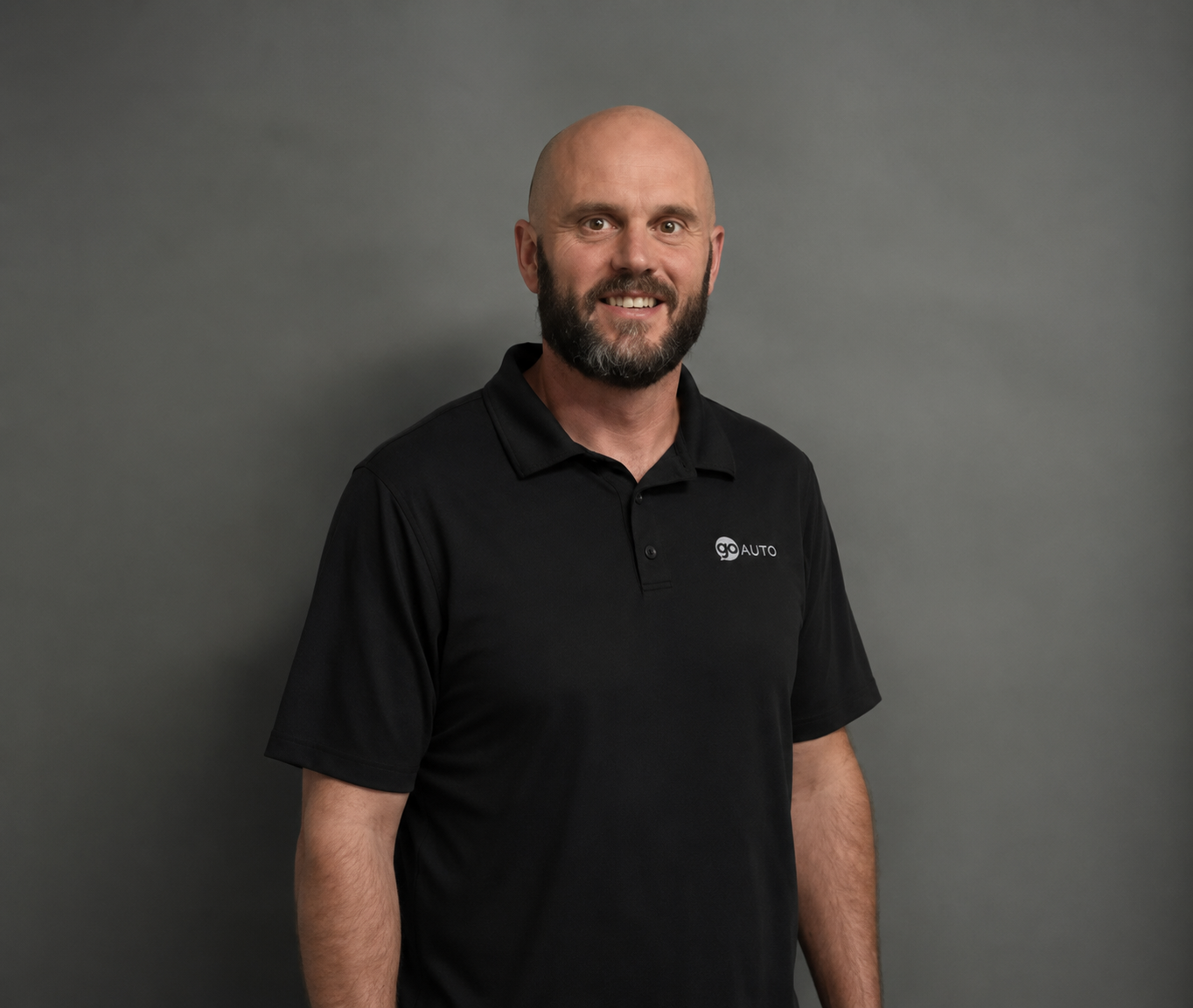 Go Auto team member Trevor MacDonald in black polo shirt