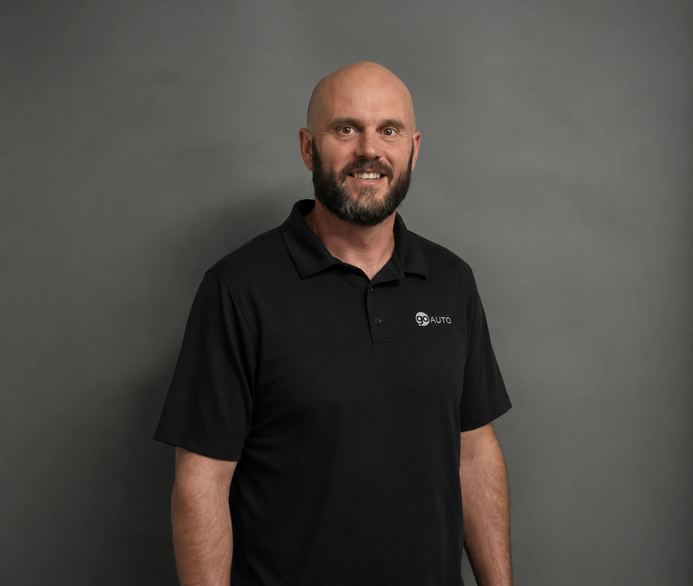 Go Auto team member Trevor MacDonald in black polo shirt